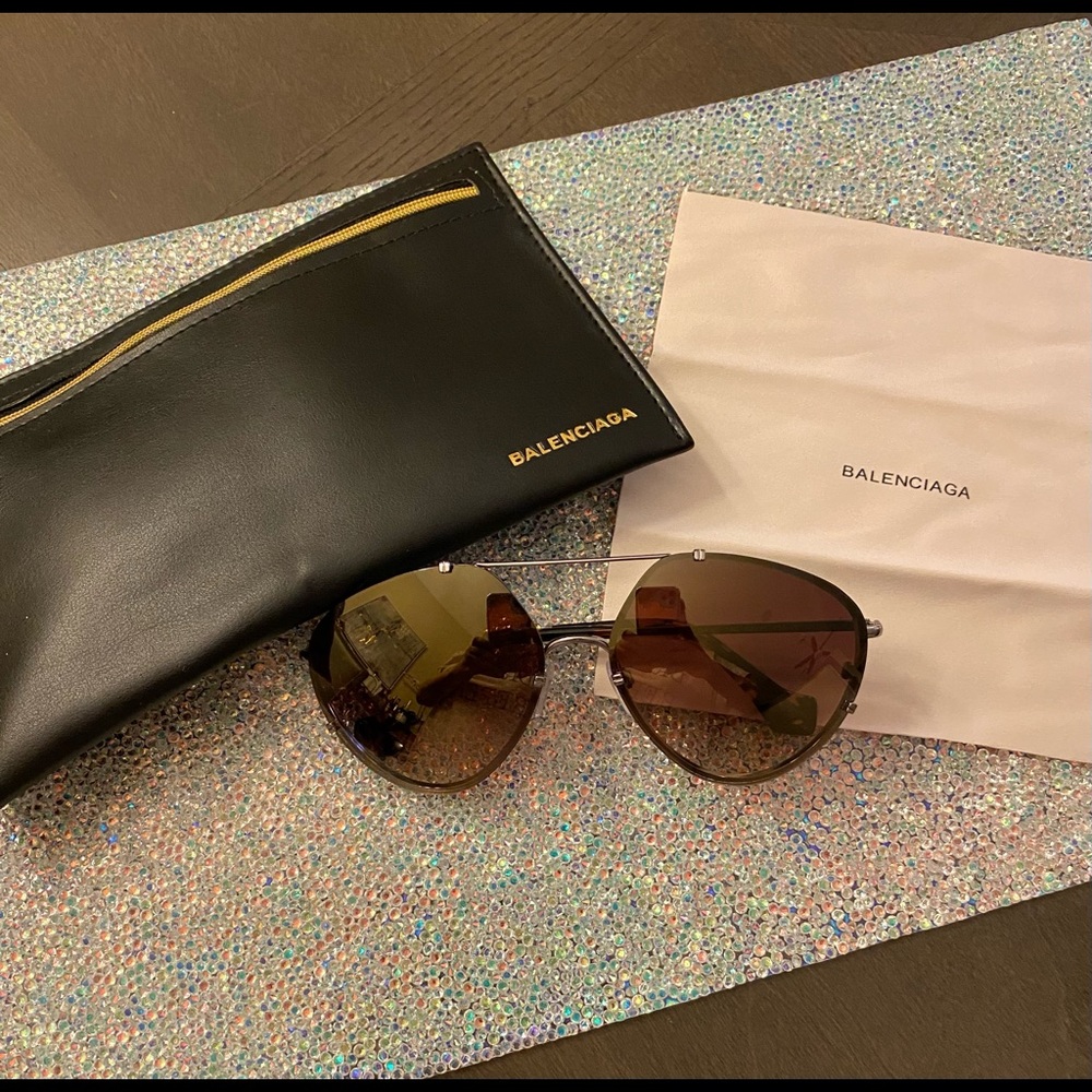 Balenciaga sunglasses with case and cloth.
